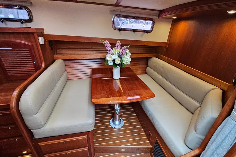 Slide: The Image of Luxurious interior of 2015 Sabre 42 Salon Express with elegant wood finish and cozy seating. - 49