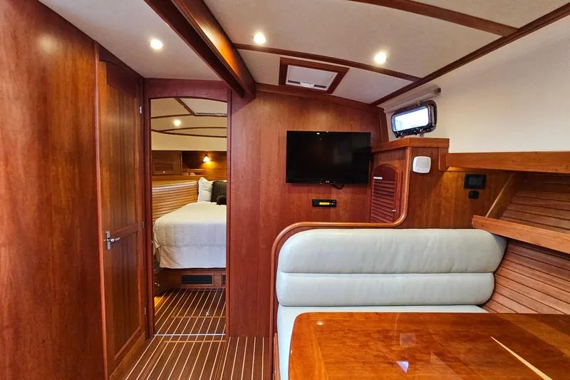 Slide: The Image of Luxurious interior of 2015 Sabre 42 Salon Express yacht with wood finish and cozy seating. - 50