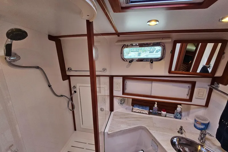 Slide: The Image of Interior of 2015 Sabre 42 Salon Express yacht bathroom with shower and sink. - 54