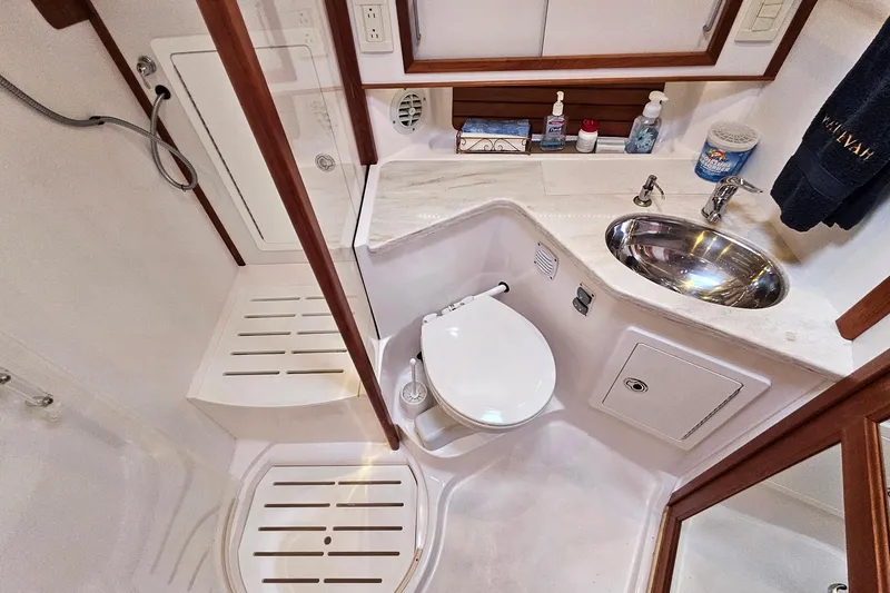 Slide: The Image of Bathroom interior of 2015 Sabre 42 Salon Express yacht, featuring shower and sink. - 55