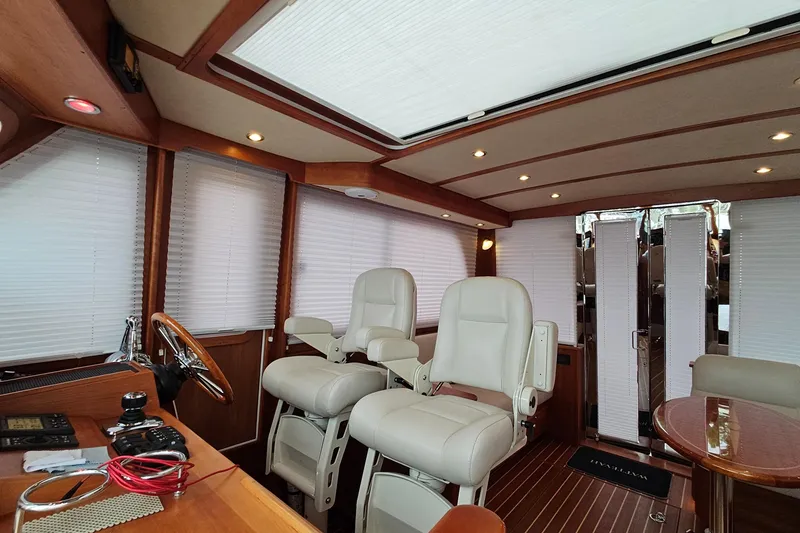 Slide: The Image of Luxurious interior of 2015 Sabre 42 Salon Express yacht with plush seating and wooden accents. - 56