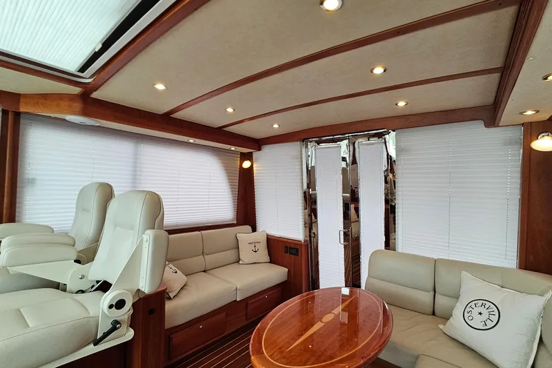 Slide: The Image of Luxurious interior of 2015 Sabre 42 Salon Express yacht with plush seating and elegant wood finishes. - 57