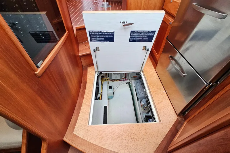 Slide: The Image of 2015 Sabre 42 Salon Express interior with open hatch revealing storage compartment. - 59
