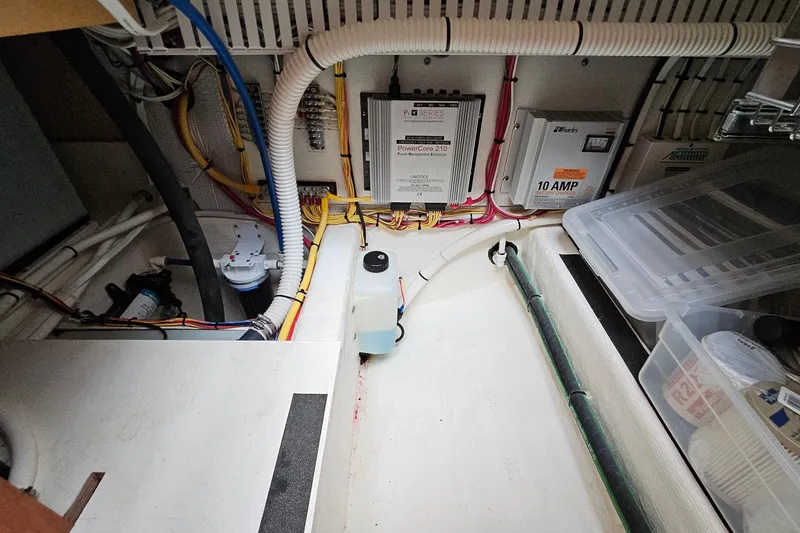 Slide: The Image of Engine room of 2015 Sabre 42 Salon Express with wiring and electrical components. - 60