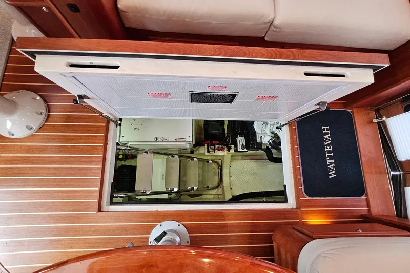 Slide: The Image of Engine room access on 2015 Sabre 42 Salon Express yacht with wooden flooring. - 61