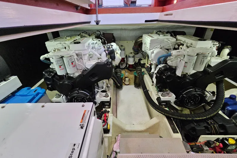 Slide: The Image of Engine room of a 2015 Sabre 42 Salon Express yacht, showcasing dual engines. - 62