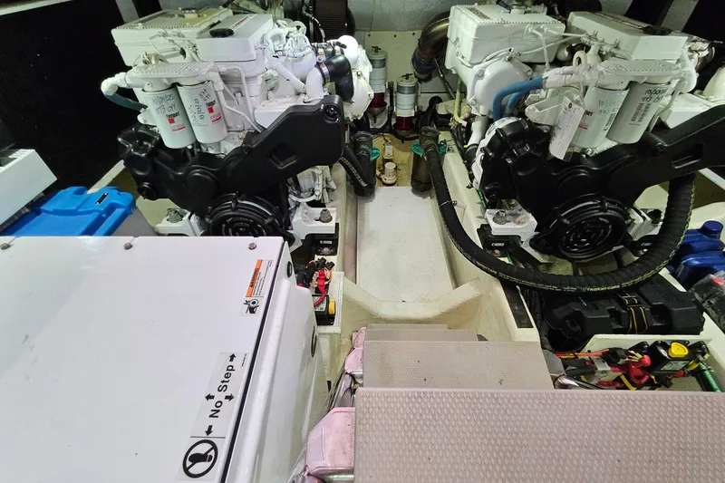 Slide: The Image of Engine room of a 2015 Sabre 42 Salon Express yacht, showcasing dual engines. - 63