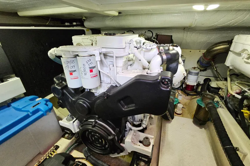 Slide: The Image of Engine room of a 2015 Sabre 42 Salon Express yacht, showcasing detailed machinery. - 65