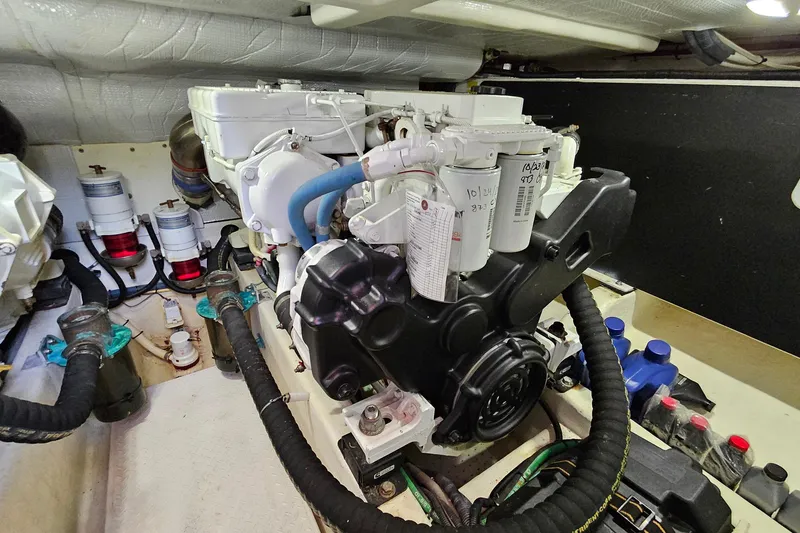 Slide: The Image of Engine room of 2015 Sabre 42 Salon Express, showcasing detailed mechanical components. - 66