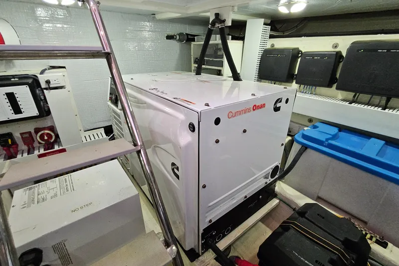 Slide: The Image of Engine room of 2015 Sabre 42 Salon Express with Cummins Onan generator. - 68