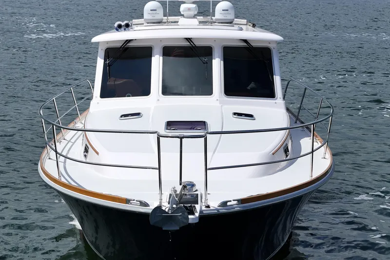 Slide: The Image of 2015 Sabre 42 Salon Express yacht on water, front view. - 8