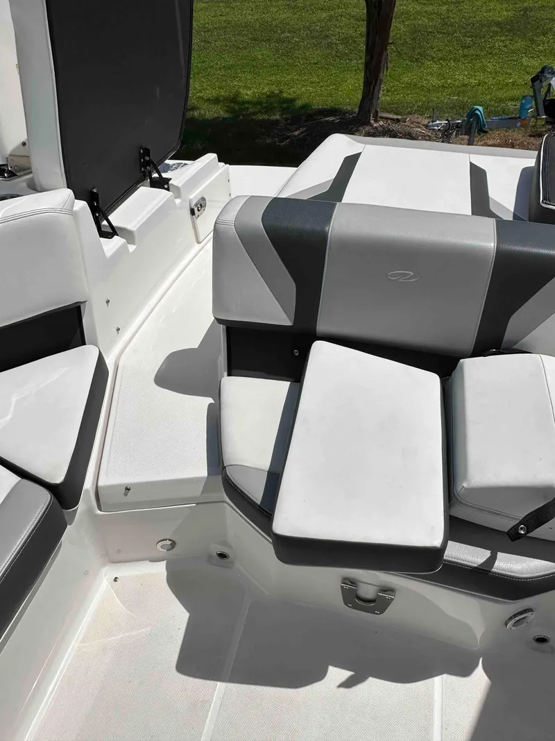 Slide: The Image of 2019 Regal 2000 ES Bowrider boat interior seating with gray and white upholstery. - 11