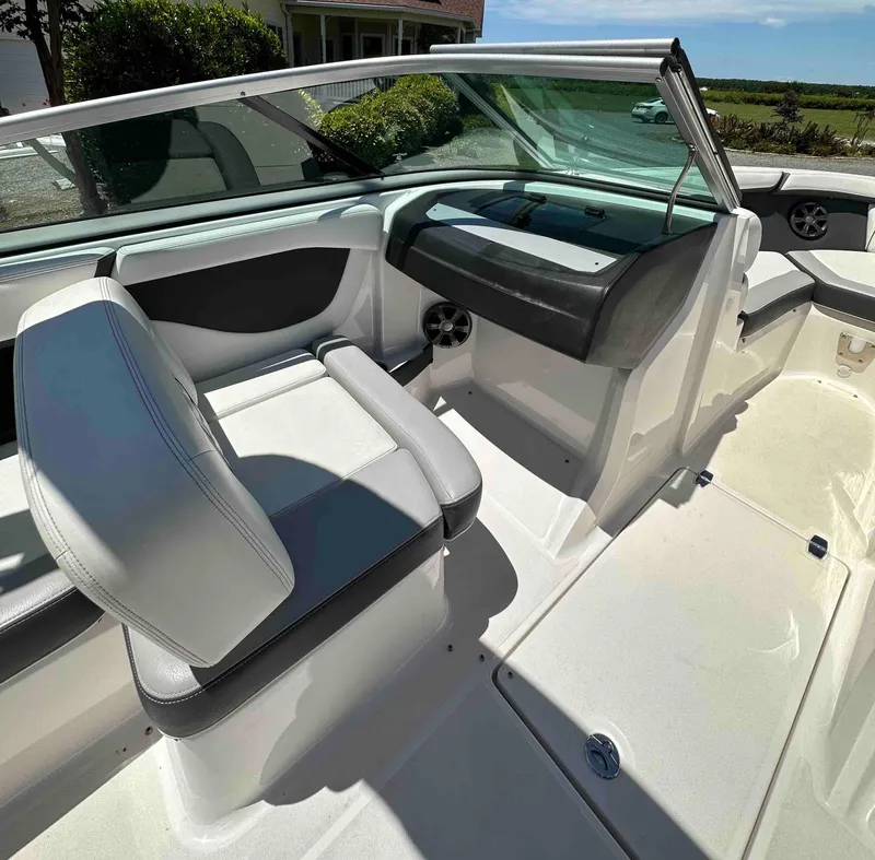 Slide: The Image of 2019 Regal 2000 ES Bowrider interior with white and gray seating, dashboard, and windshield. - 13