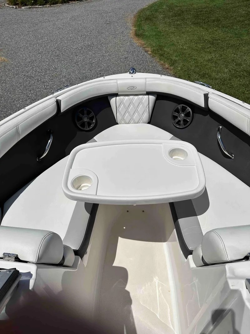 Slide: The Image of 2019 Regal 2000 ES Bowrider interior with seating and table. - 14