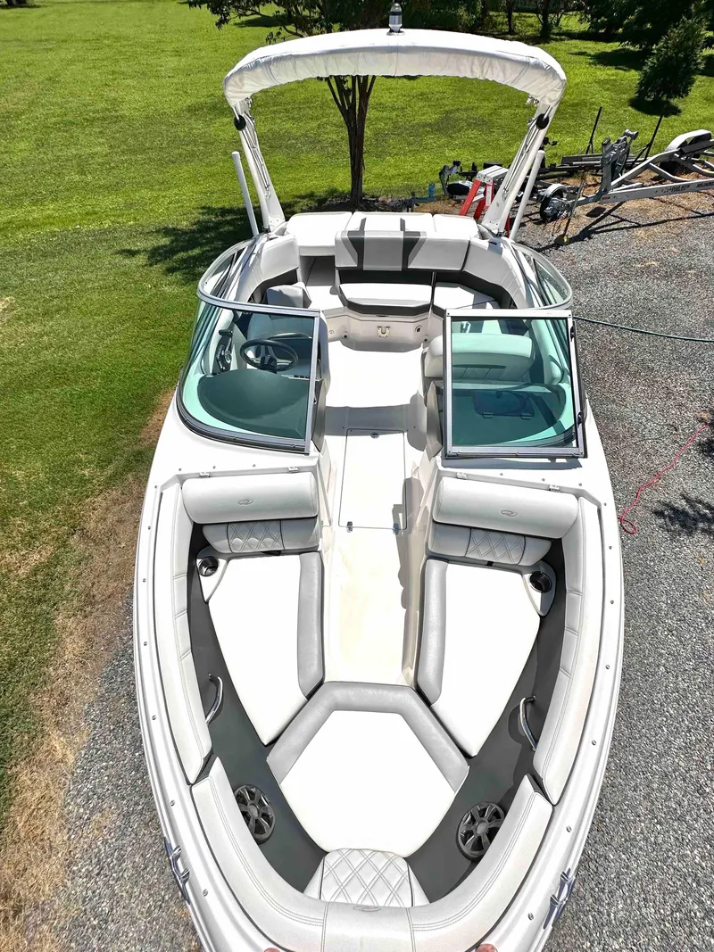 Slide: The Image of 2019 Regal 2000 ES Bowrider boat with open bow seating and bimini top. - 17