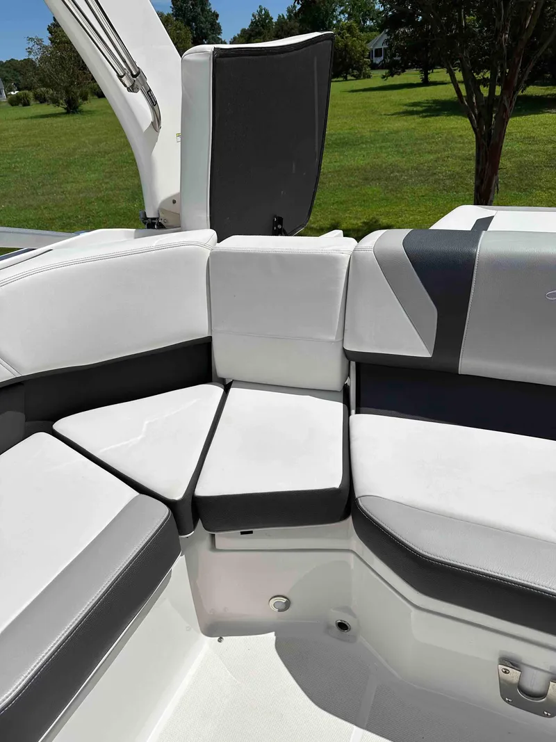 Slide: The Image of 2019 Regal 2000 ES Bowrider interior seating with white and gray upholstery. - 19