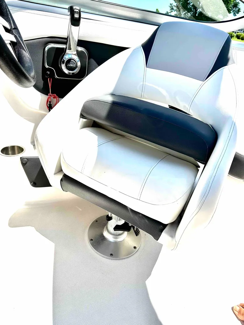 Slide: The Image of 2019 Regal 2000 ES Bowrider captain's chair and control panel. - 20