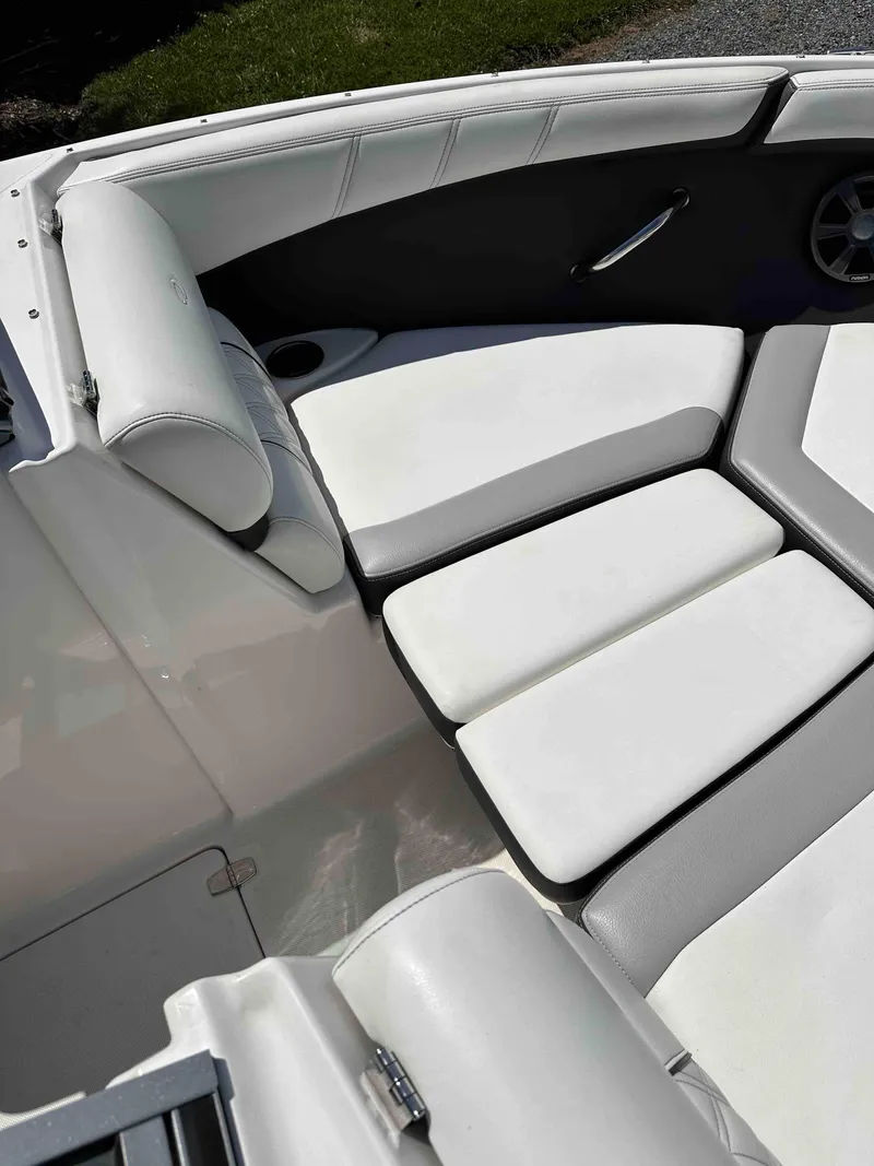 Slide: The Image of 2019 Regal 2000 ES Bowrider boat with white cushioned seating. - 21