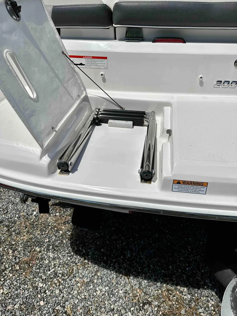 Slide: The Image of 2019 Regal 2000 ES Bowrider swim platform with storage compartment. - 23