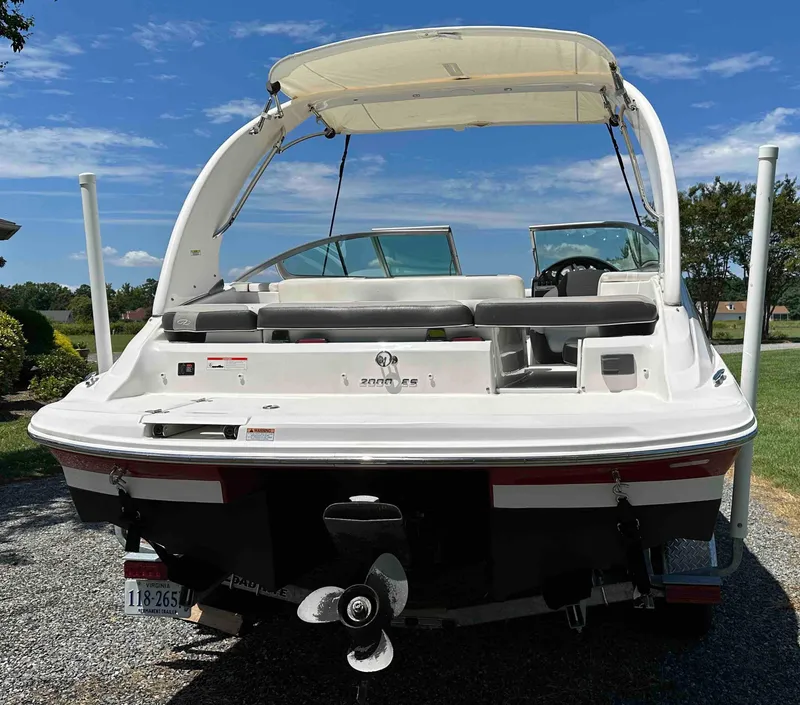 Slide: The Image of 2019 Regal 2000 ES Bowrider boat, rear view with canopy and seating. - 24