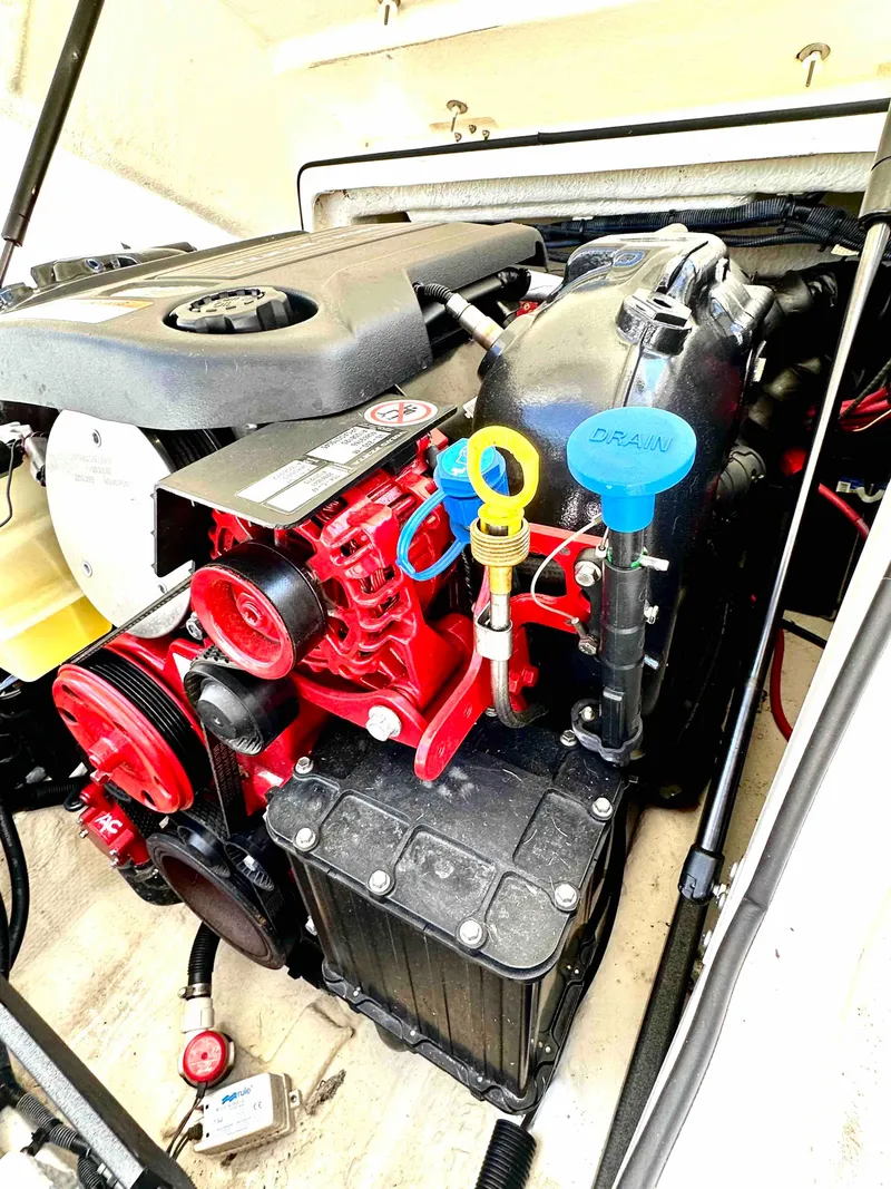 Slide: The Image of 2019 Regal 2000 ES Bowrider engine compartment with red and black components. - 26