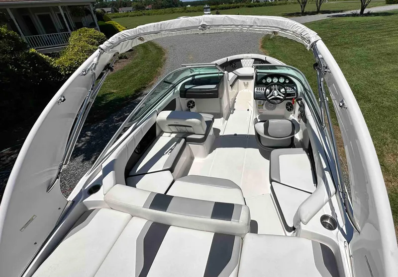 Slide: The Image of 2019 Regal 2000 ES Bowrider boat interior with white and gray seating. - 4