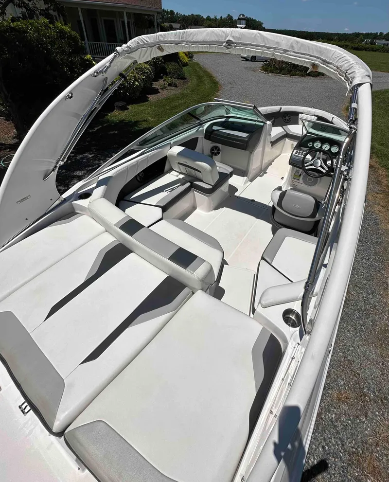 Slide: The Image of 2019 Regal 2000 ES Bowrider boat with white interior and seating. - 5