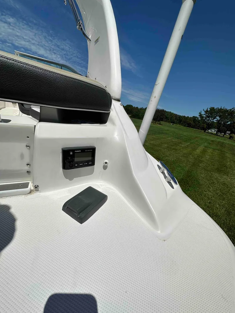 Slide: The Image of 2019 Regal 2000 ES Bowrider interior detail with control panel and seating. - 7