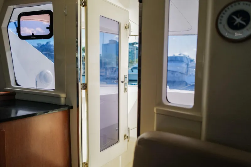 Slide: The Image of Interior view of a 2012 Leopard 44 yacht, featuring a door and windows. - 10