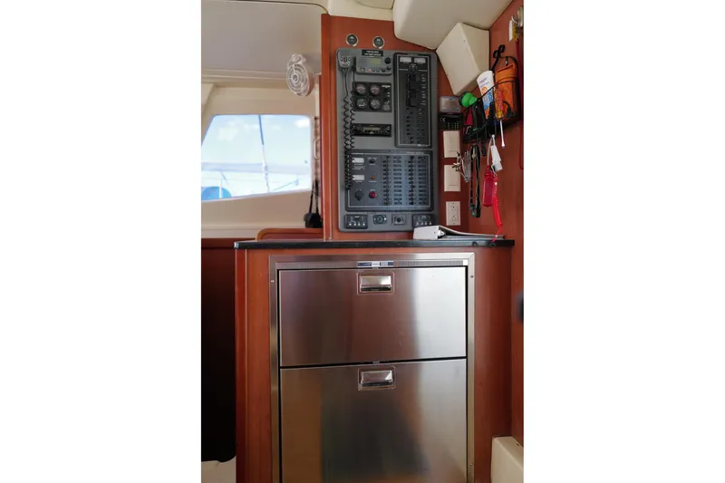 Slide: The Image of Control panel and storage in 2012 Leopard 44 yacht interior. - 13