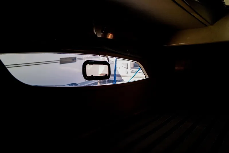 Slide: The Image of Interior view of a 2012 Leopard 44 yacht, showcasing a window with exterior reflections. - 27