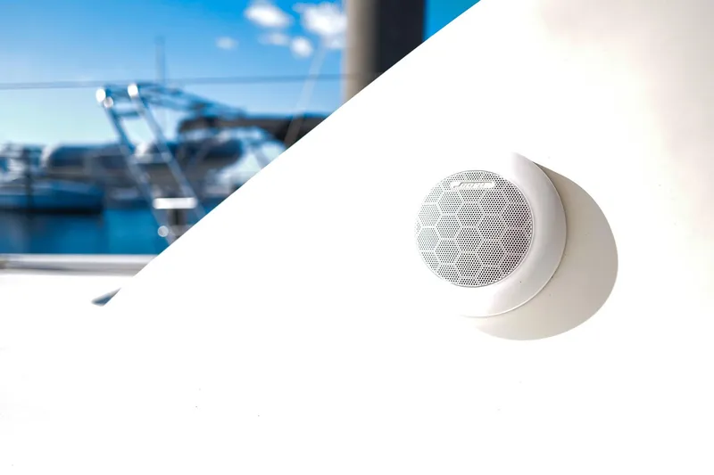 Slide: The Image of Outdoor speaker on a 2012 Leopard 44 yacht, with marina background. - 32