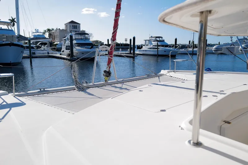 Slide: The Image of Leopard 44 catamaran docked at marina, surrounded by boats, clear sky, 2012 model. - 33