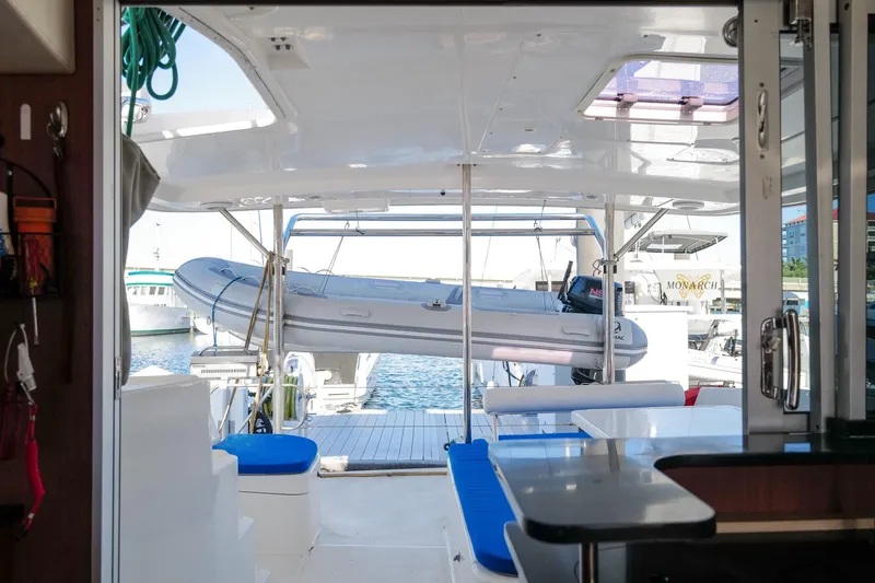 Slide: The Image of Interior view of a 2012 Leopard 44 catamaran with a dinghy on the deck. - 39