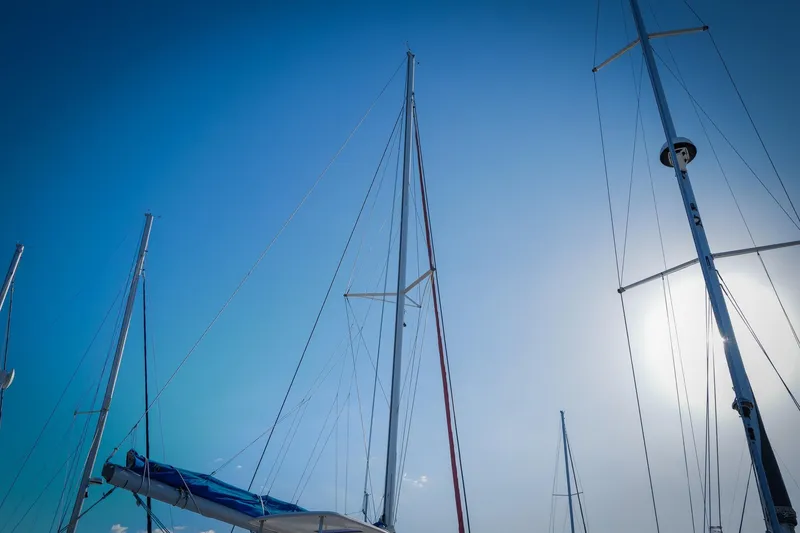 Slide: The Image of Sailboat masts against a clear blue sky, Leopard 44 model, 2012. - 40