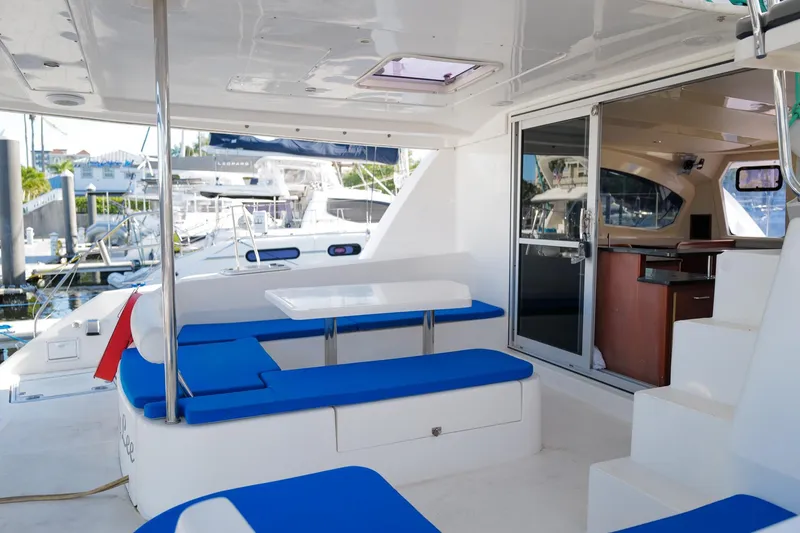 Slide: The Image of 2012 Leopard 44 yacht interior with blue seating and dining area. - 5