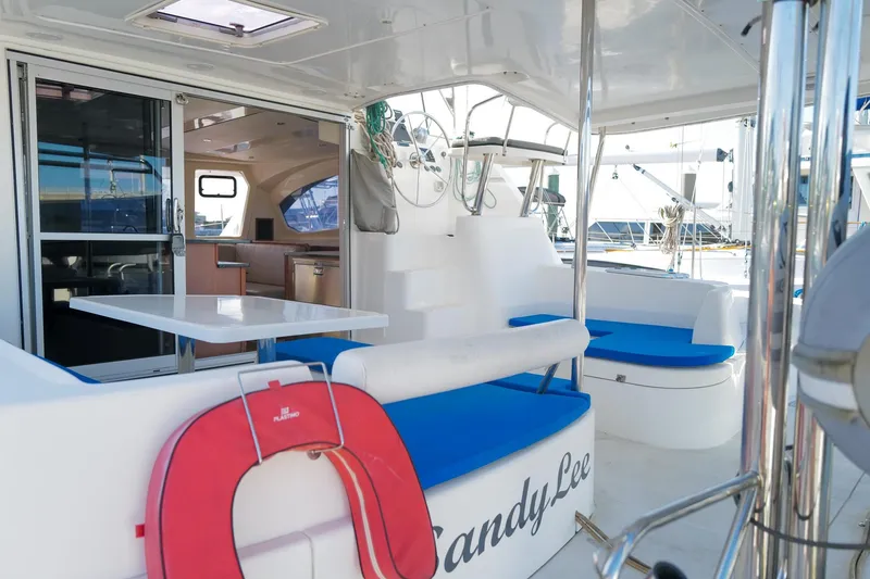 Slide: The Image of Luxurious 2012 Leopard 44 catamaran with spacious deck, seating, and interior view. - 6