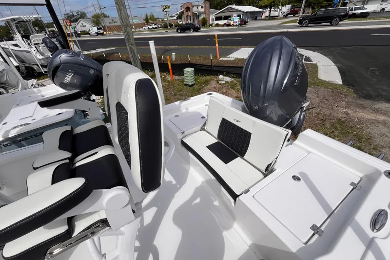 Slide: The Image of 2026 Tidewater 2210 Carolina Bay boat with Yamaha engines, featuring sleek seating and modern design. - 13