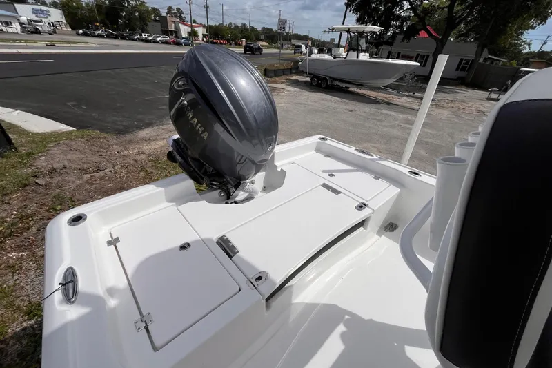 Slide: The Image of 2026 Tidewater 2210 Carolina Bay boat with Yamaha outboard motor, parked on a trailer. - 4