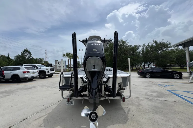 Slide: The Image of 2023 Blazer 2550 GTS boat with powerful 350 engine in parking lot. - 13