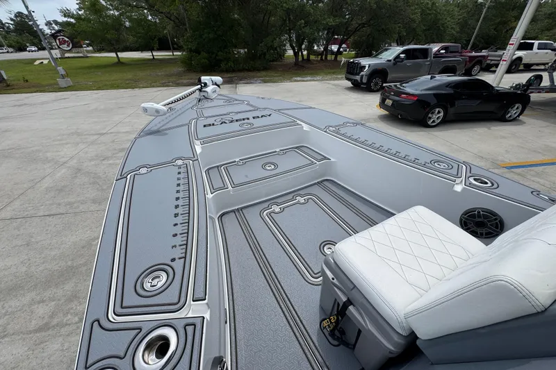 Slide: The Image of 2023 Blazer 2550 GTS boat with sleek deck design at a parking area. - 18