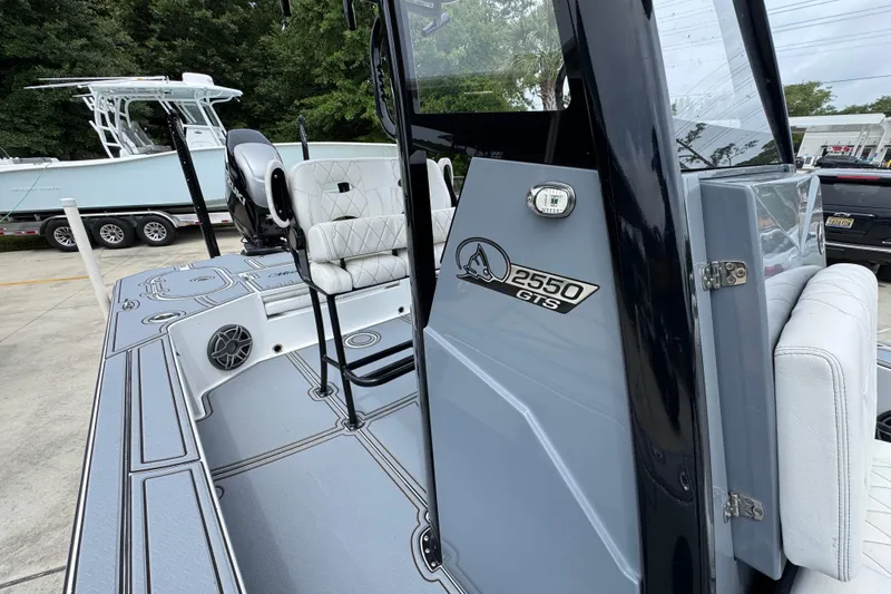 Slide: The Image of 2023 Blazer 2550 GTS boat interior with seating and console details. - 24