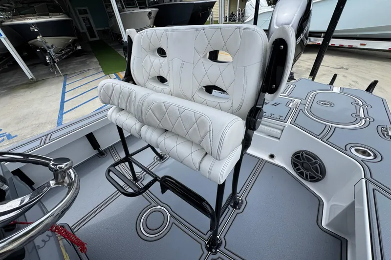 Slide: The Image of 2023 Blazer 2550 GTS boat interior with white cushioned seating and sleek design. - 25