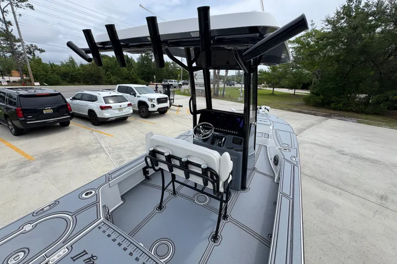 Slide: The Image of 2023 Blazer 2550 GTS boat with sleek design, parked near vehicles. - 33