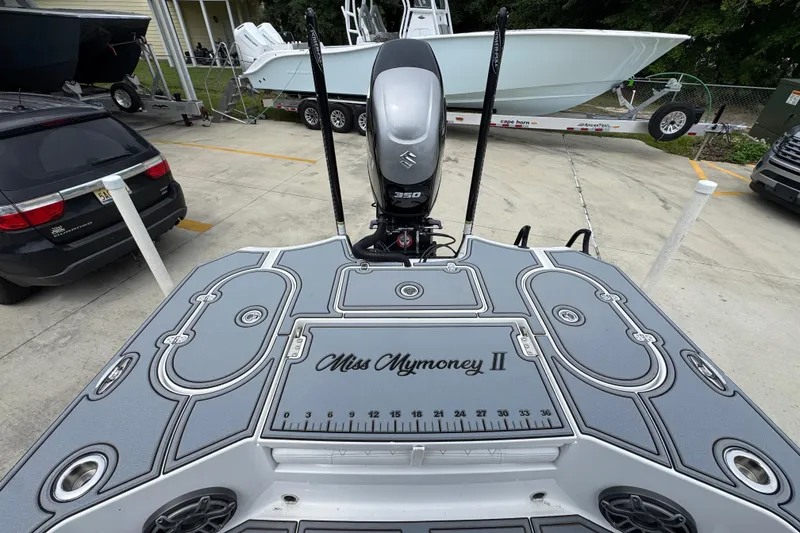 Slide: The Image of 2023 Blazer 2550 GTS boat deck with Suzuki 350 engine, parked in a lot. - 35