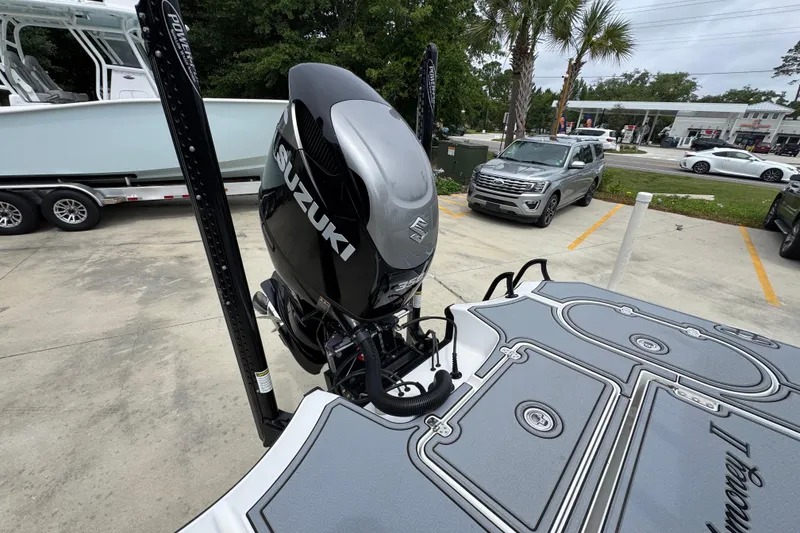 Slide: The Image of 2023 Blazer 2550 GTS boat with Suzuki outboard motor in a parking lot. - 38