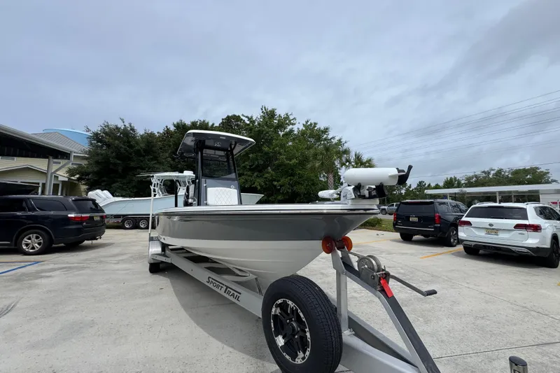 Slide: The Image of 2023 Blazer 2550 GTS boat on trailer in parking lot, overcast sky. - 6