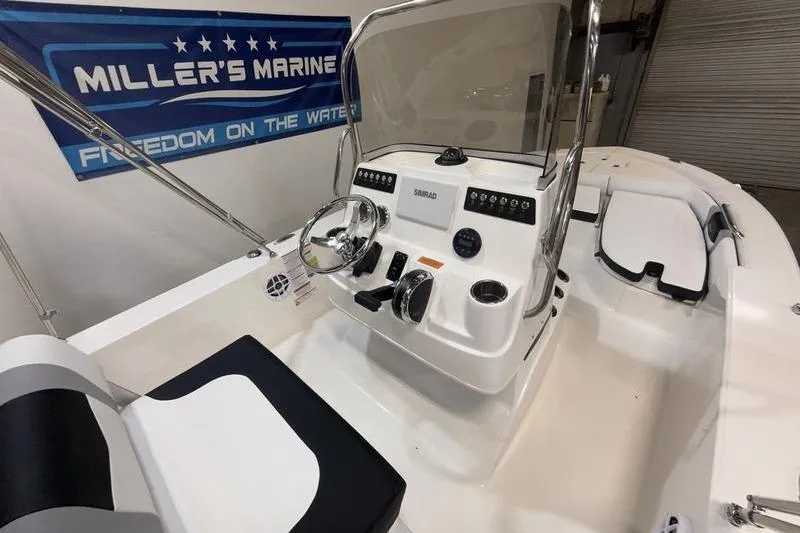 Slide: The Image of Interior view of 2026 Robalo 206 Cayman boat at Miller's Marine. - 11