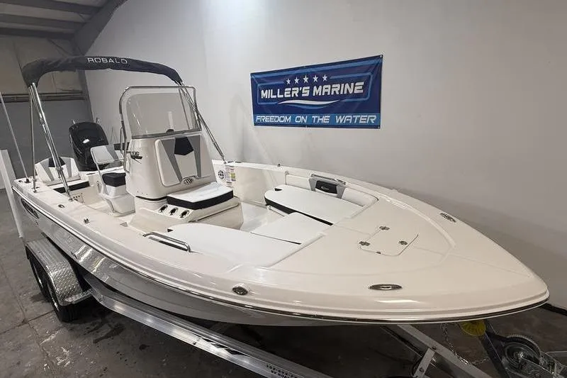 Slide: The Image of 2026 Robalo 206 Cayman boat at Miller's Marine. - 2