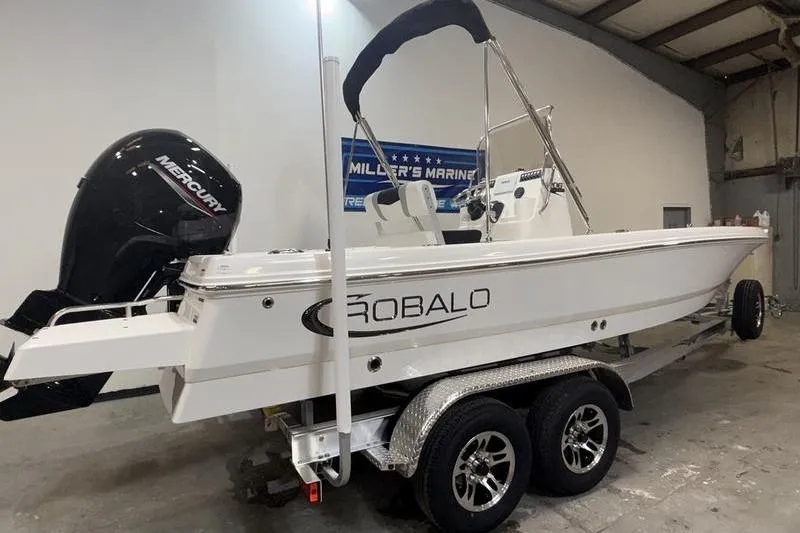 Slide: The Image of 2026 Robalo 206 Cayman boat on trailer in warehouse. - 3